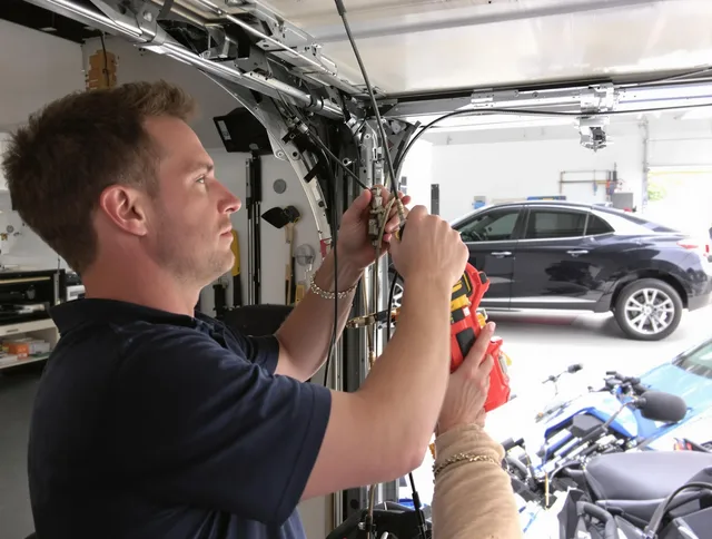 Stonington Garage Door Repair safety certified technician performing cable replacement in Stonington