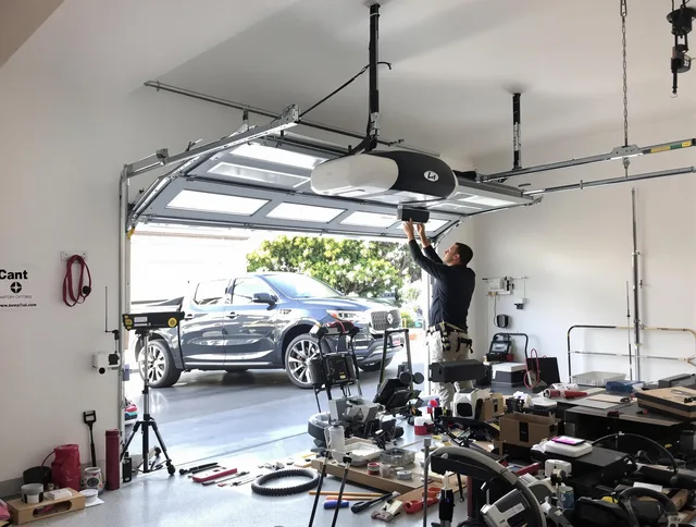 Stonington Garage Door Repair specialist installing smart garage door opener system in Stonington home