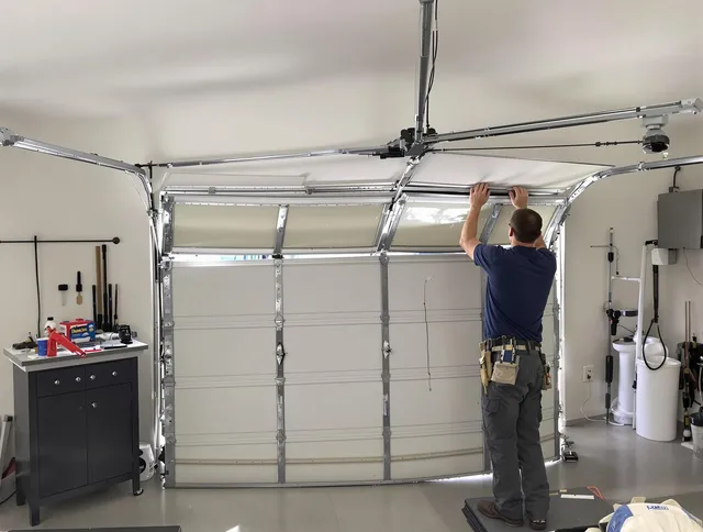 Stonington Garage Door Repair specialist performing precise section replacement on Stonington garage door